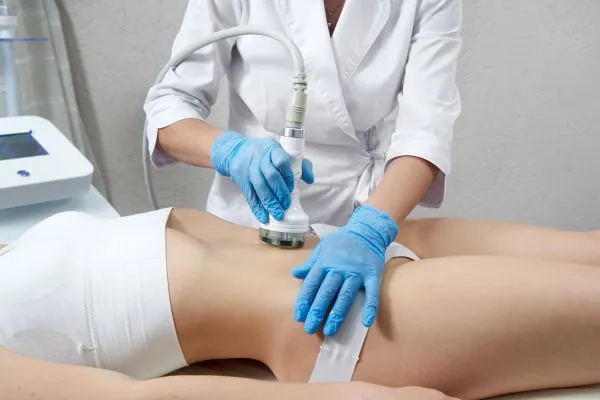 Lost the Weight but Not the Loose Skin? 2 woman having HIFU treatment on her stomach to combat loose skin Acocks Green following weight loss